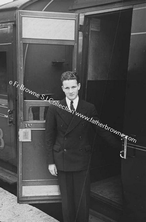 BOY OUTSIDE RAILWAY CARRIAGE